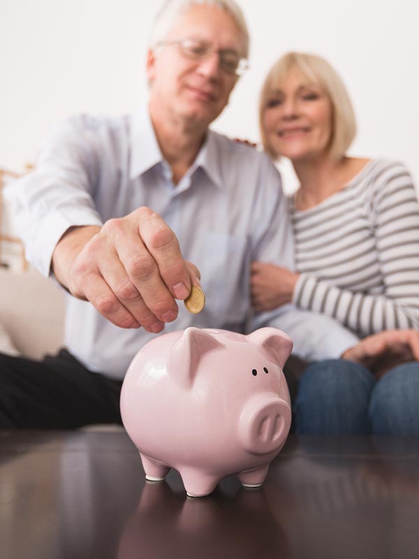 A senior couple saving money